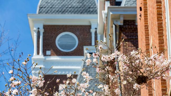 Flowers bloom in front of a Waynesburg building