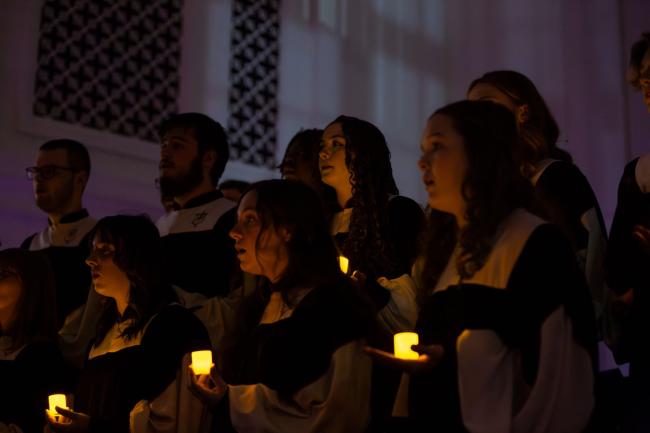 Lamplighters sing with candles during fall 2024 Christmas concert