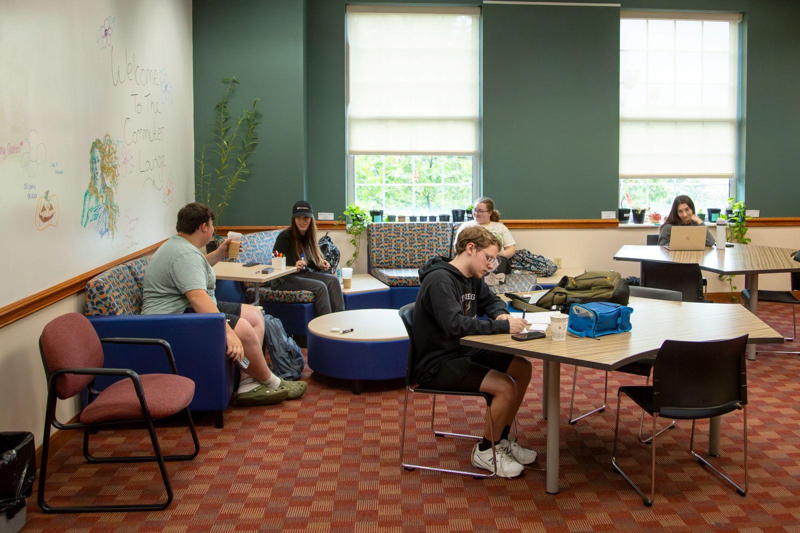 Students sit and study in new Commuter Lounge on campus