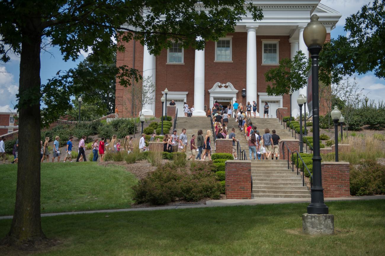 students walking into a building