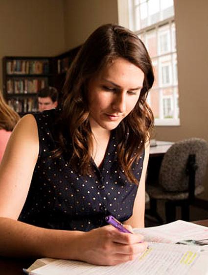 Student studies in the library