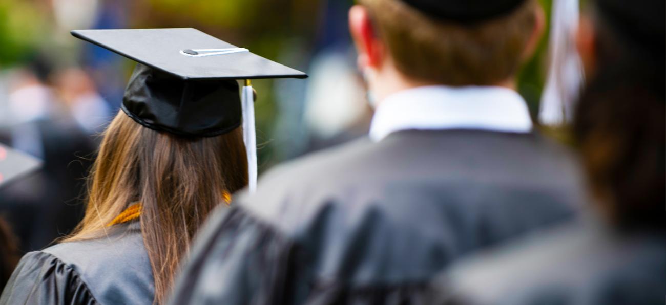 Graduate wearing Commencement regalia