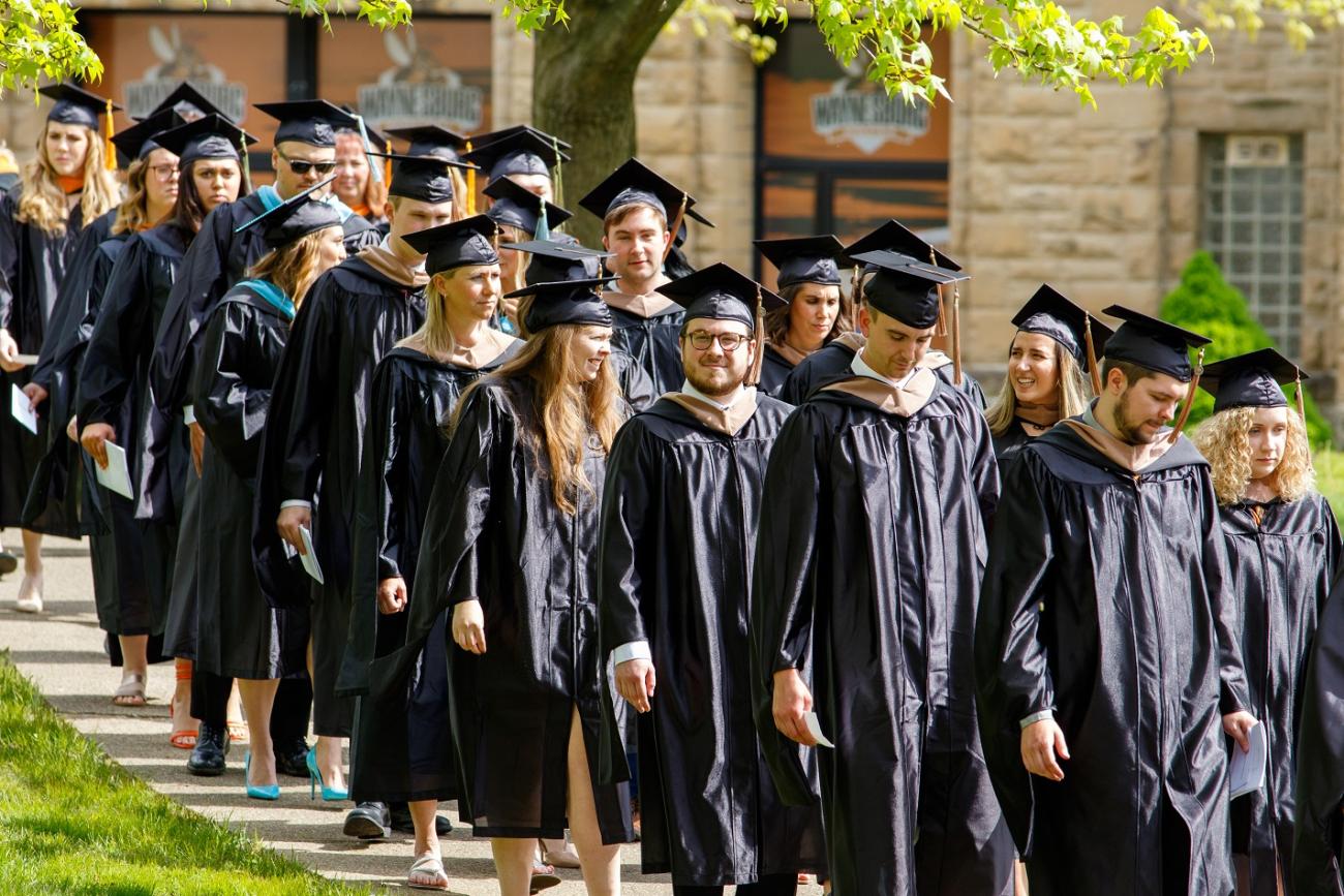 students processing during graduation ceremony