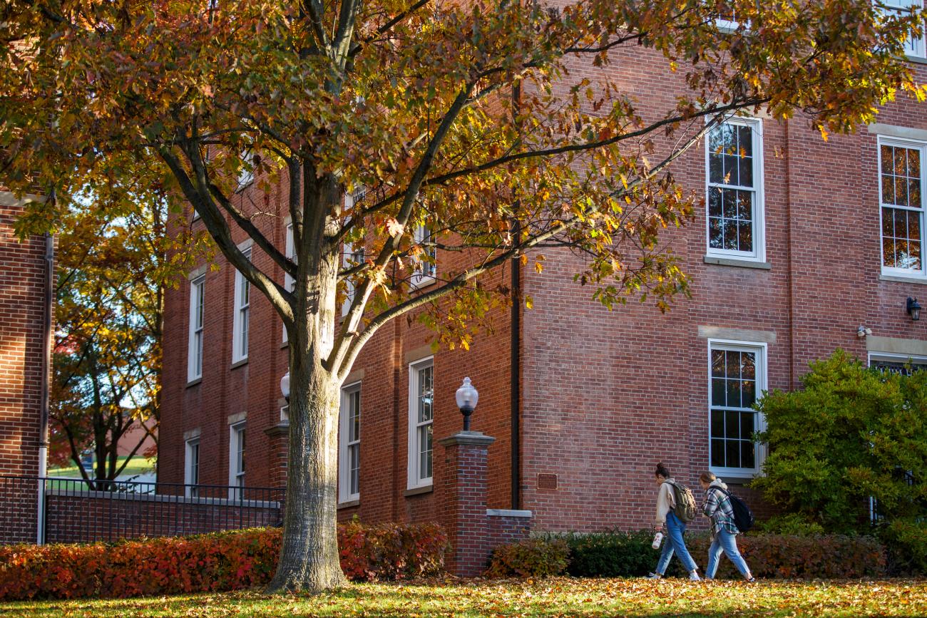 Waynesburg students walking between Miller Hall and Hanna Hall in the fall