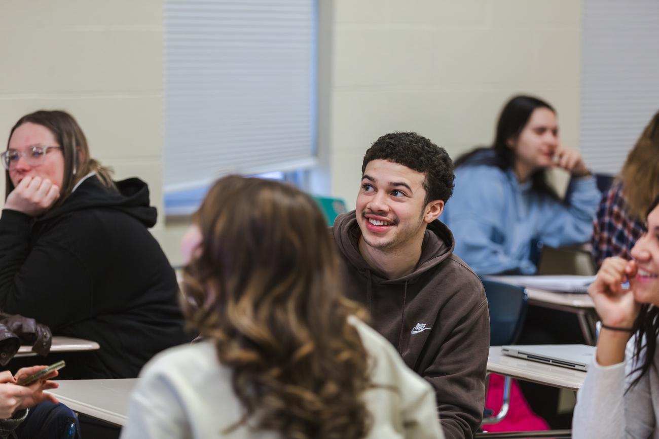 student smiling in class