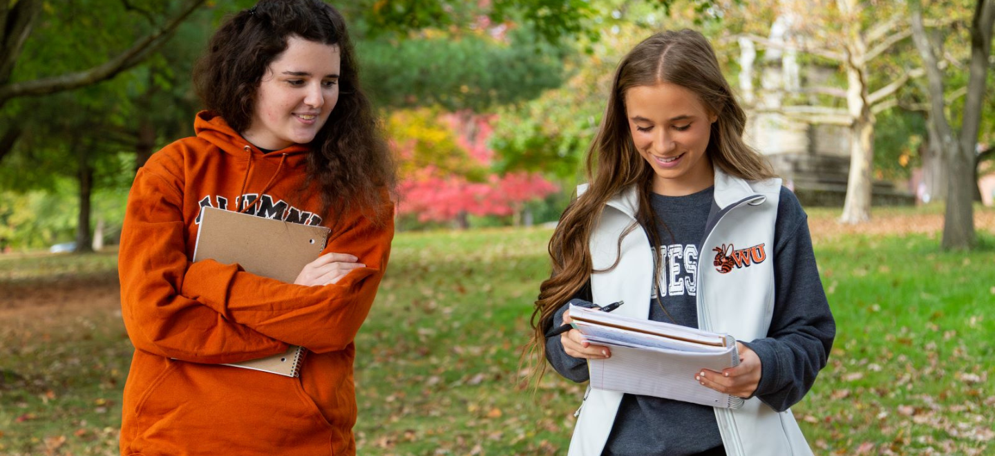 Waynesburg students walking through the parks on campus