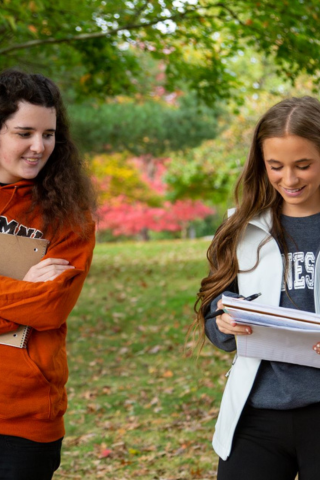 Waynesburg students walking through the parks on campus