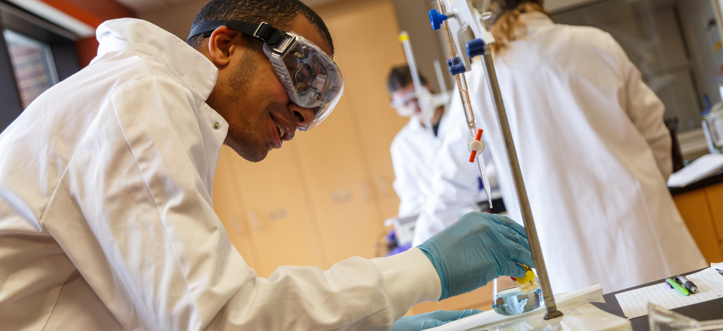 Chemistry student working in the chemistry lab with beakers