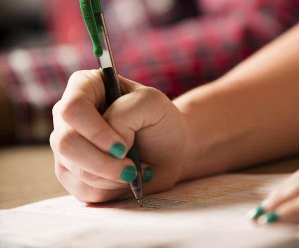 hand with pen writing 