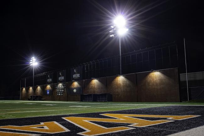 The new stadium wall at nighttime with lights