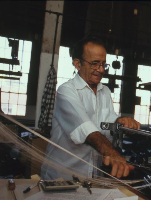 Man Working at Loom in Modern Factory