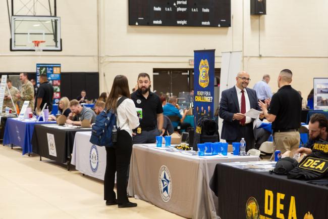 Students meet with recruiters at the CJ Fair on campus