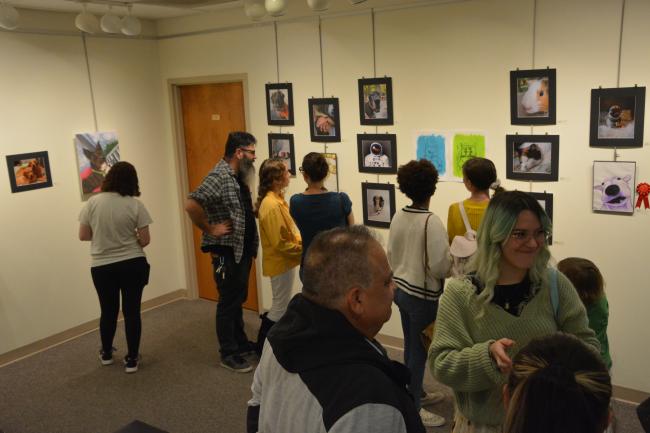 Image of fall 2022 student art show with attendants