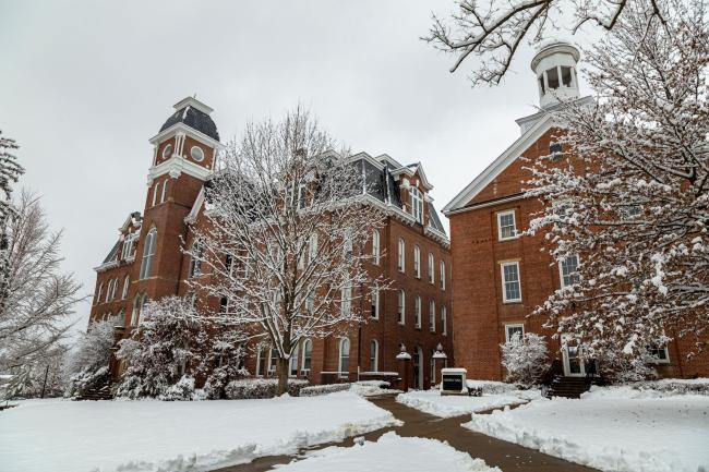 Snow covering the ground in front of Miller and Hanna Halls on campus